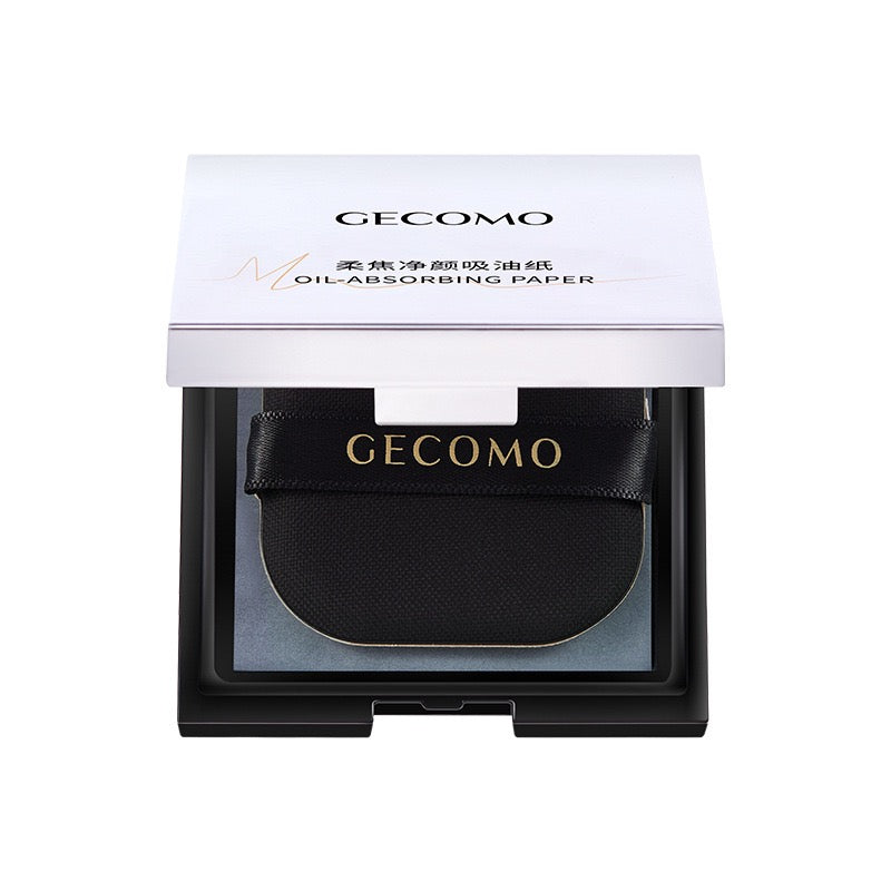 Portable facial oil-absorbing paper with puff and mirror case